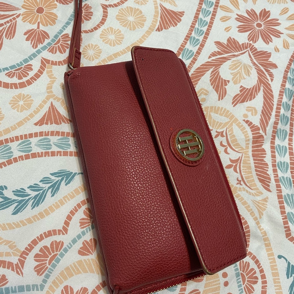 Adorable TH wristlet! Enough room for cards, cash, and change.
